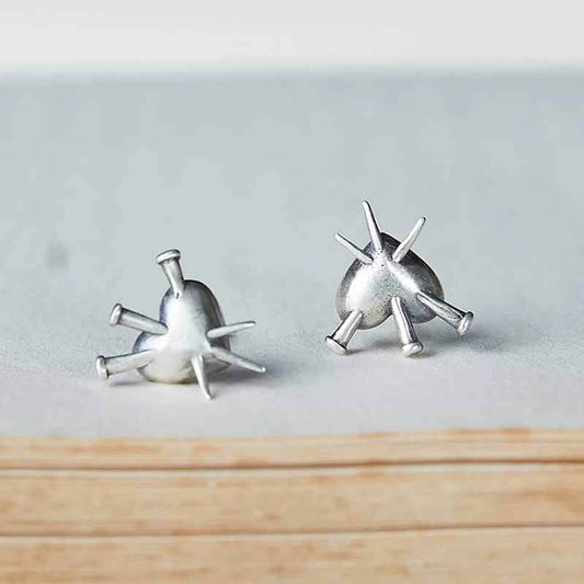Nailed Piercing Heart Stud Earrings in Sterling Silver